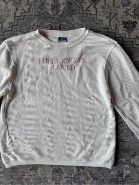 Cream Ribbed Crewneck Sweatshirt with Subtle Pink Text
